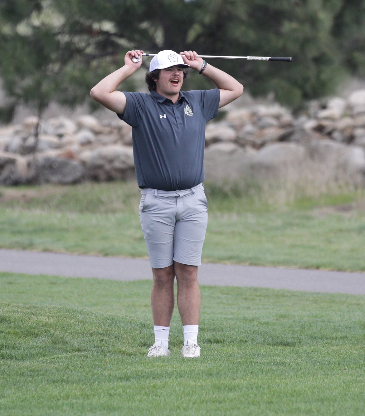 MARK NELKE/Press
Seth Swallows of St. Maries watches as he nearly holes out on the 13th hole — from the 14th fairway — during the 2A District 1-2 golf tournament Monday at The Links Golf Club in Post Falls.