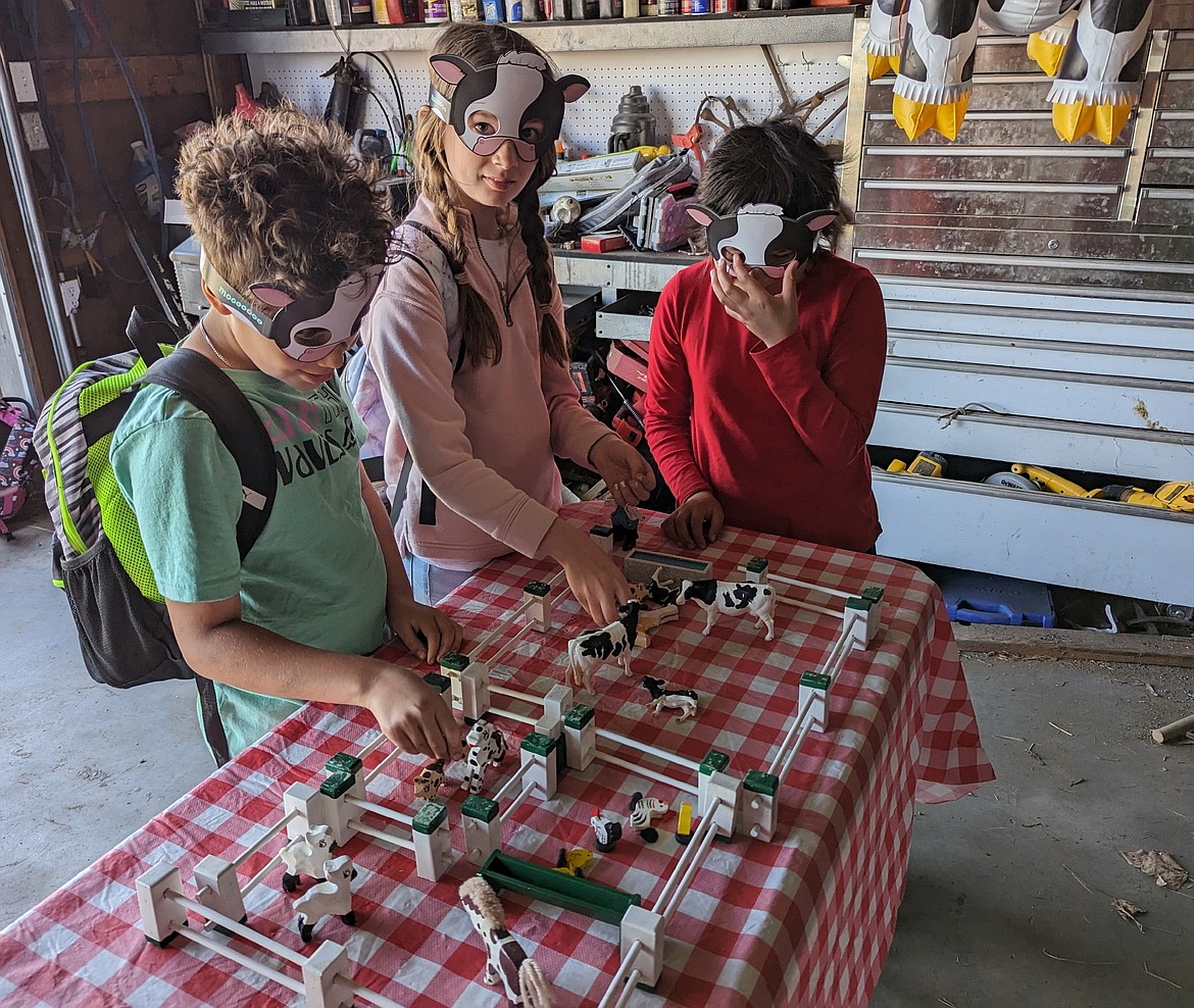 Fourth graders learn where milk comes from during Mission Valley Ag Days, held last Thursday at the Senecal Ranch near Ronan. (Susan Lake photo)