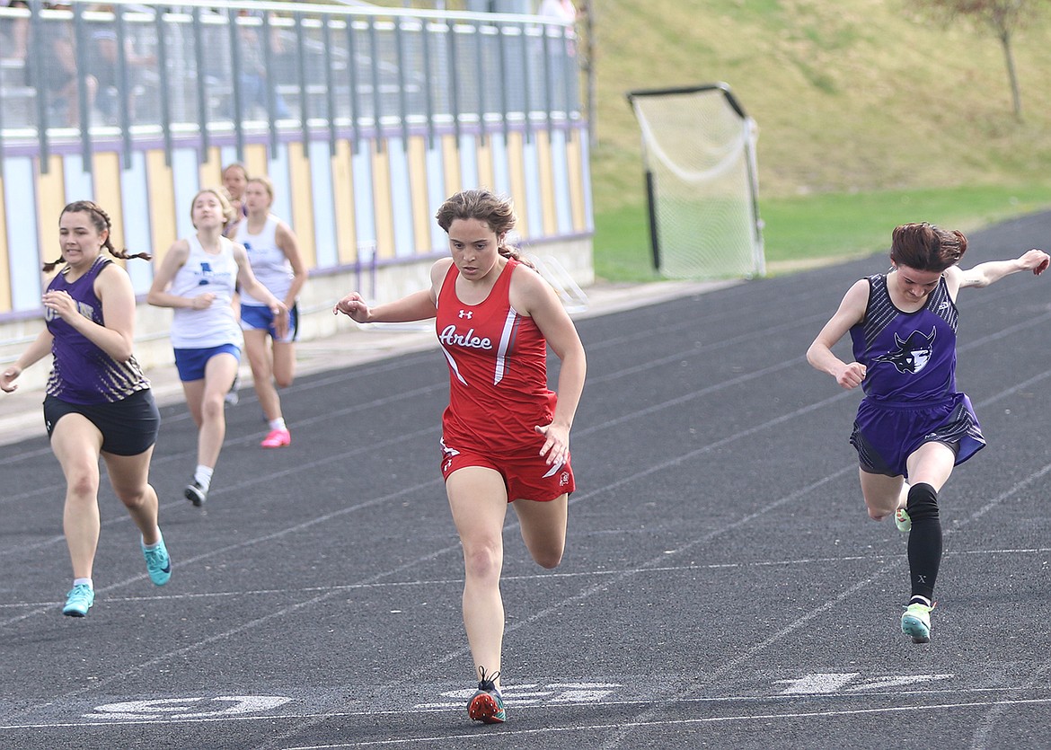 Arlee's Adalyn Jacob leads the pack in the 200m at the Lake County Track Meet. (Bob Gunderson photo)