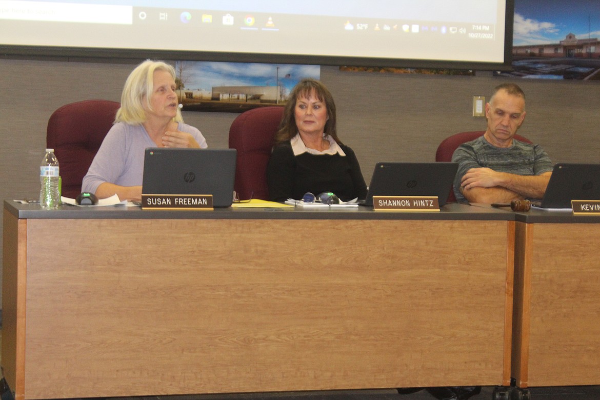 Moses Lake School Board members, from left, Susan Freeman, Shannon Hintz and Kevin Fuhr discuss business at a 2022 board meeting. The seats held by Freeman and Hintz are among those on the ballot in the November 2023 general election.