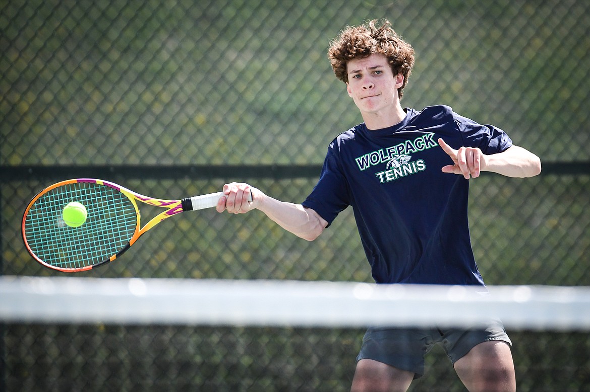 Glacier's Will Rudbach hits a return in a boys singles match against Flathead's Quaid Ring at FVCC on Tuesday, May 9. (Casey Kreider/Daily Inter Lake)