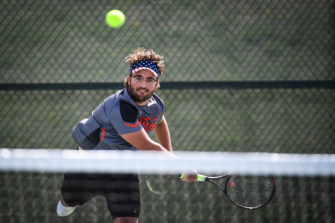 Flathead's Quaid Ring serves in a boys singles match against Glacier's Will Rudbach at FVCC on Tuesday, May 9. (Casey Kreider/Daily Inter Lake)