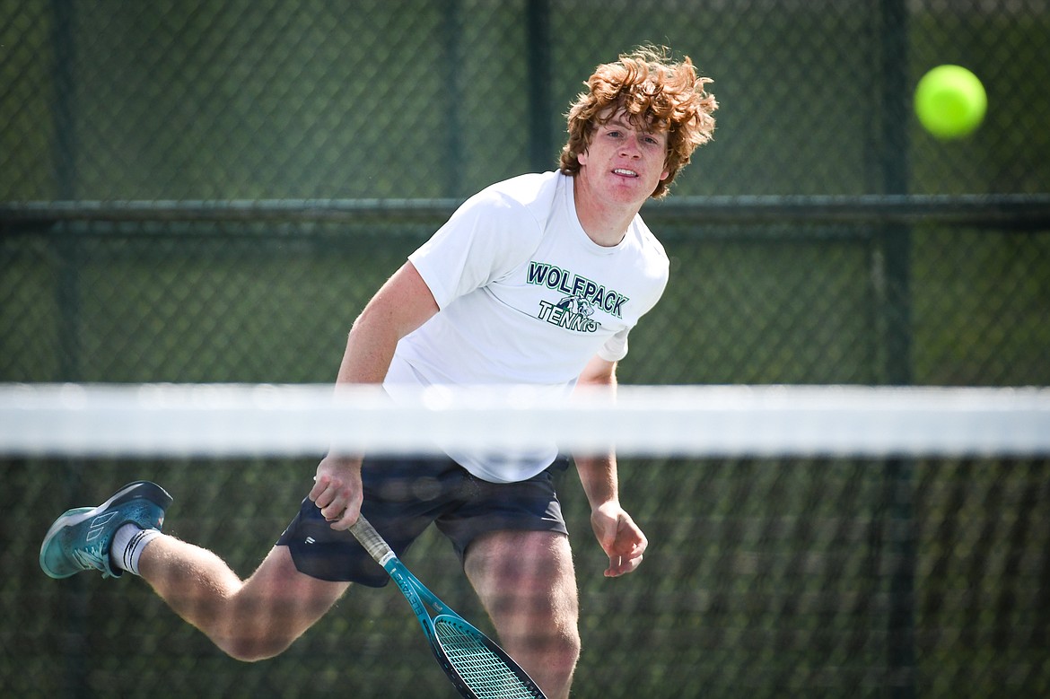 Glacier's Timmy Glanville serves in a boys doubles match with teammate Harrison Sanders against Flathead's Ezias Bailey and Tyler Shawback at FVCC on Tuesday, May 9. (Casey Kreider/Daily Inter Lake)