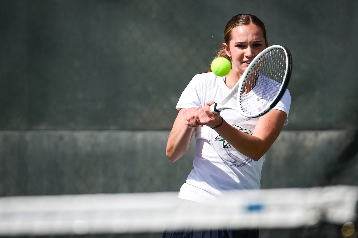 Glacier's Haven Speer hits a backhand return in a girls doubles match with teammate Sarah Downs against Flathead's Clara Jones and Emmary Faerber at FVCC on Tuesday, May 9. (Casey Kreider/Daily Inter Lake)