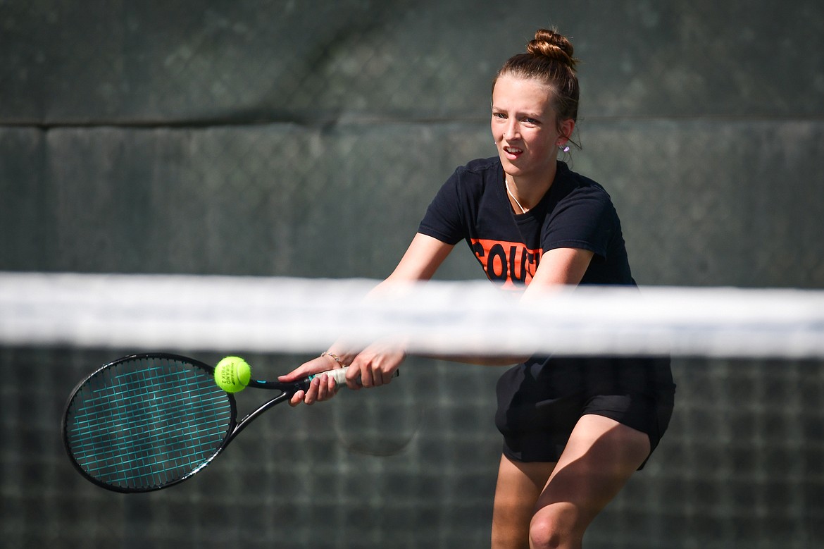 Flathead's Alexis Kersten hits a backhand return in a girls singles match with Glacier's Miley Fritz at FVCC on Tuesday, May 9. (Casey Kreider/Daily Inter Lake)