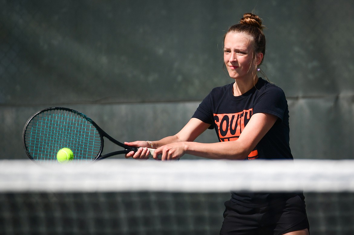 Flathead's Alexis Kersten hits a backhand return in a girls singles match with Glacier's Miley Fritz at FVCC on Tuesday, May 9. (Casey Kreider/Daily Inter Lake)