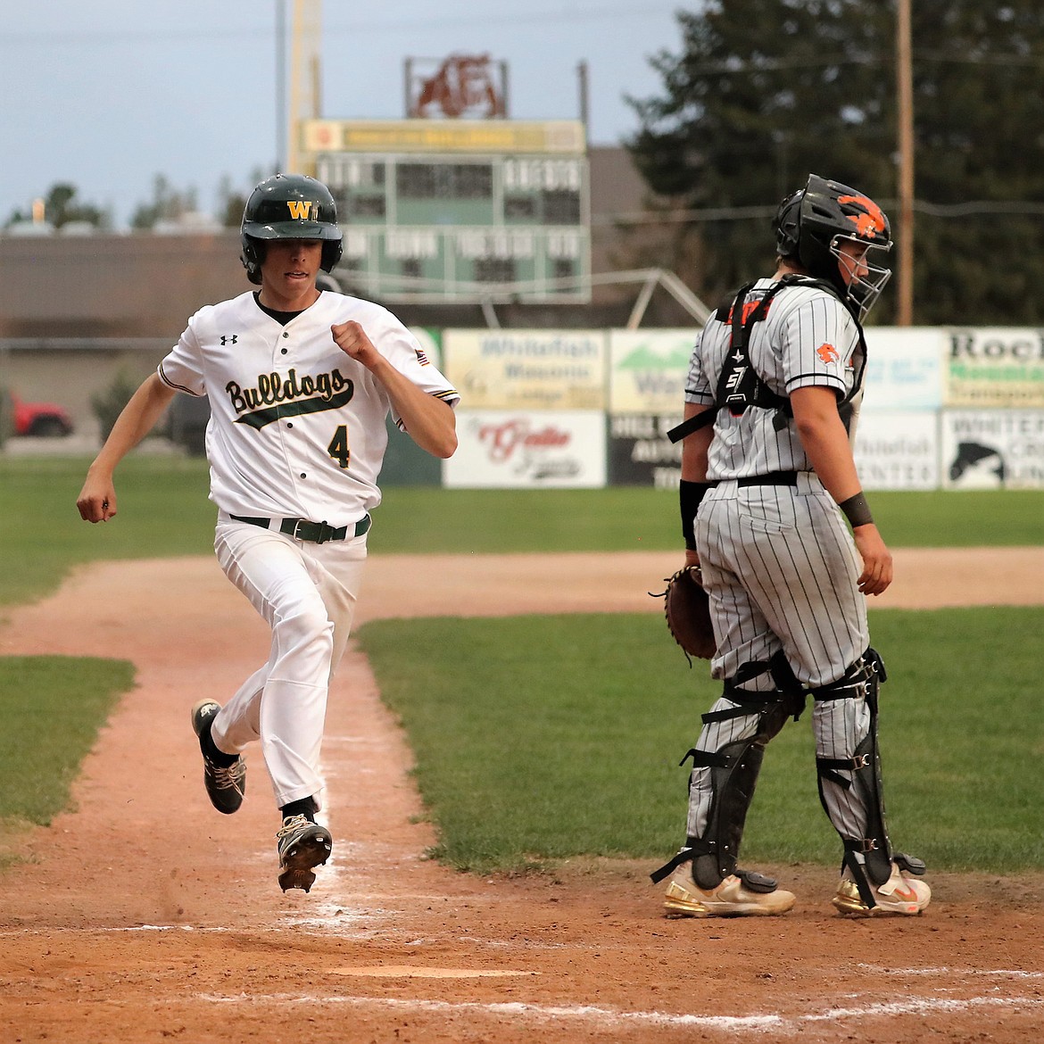 Whitefish's Maddox Muller scores a run in a game against Eureka on Tuesday, May 2 at Memorial Field. (Greg Nelson photo/Artwestimage.net)