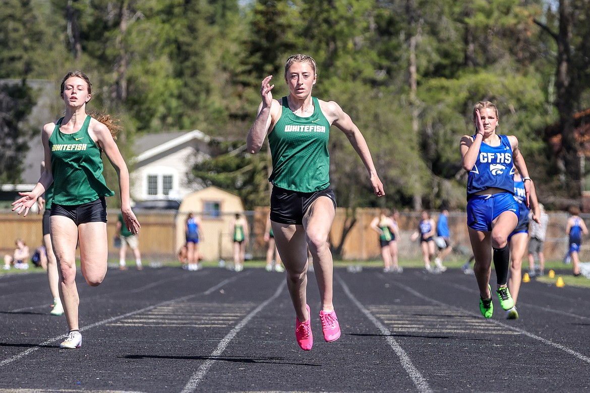 Whitefish's Brooke Zetooney and Rachael Wilmot race in the 100 meter dash at the Cat-Dog invite on Tuesday,  May 2. (JP Edge photo)