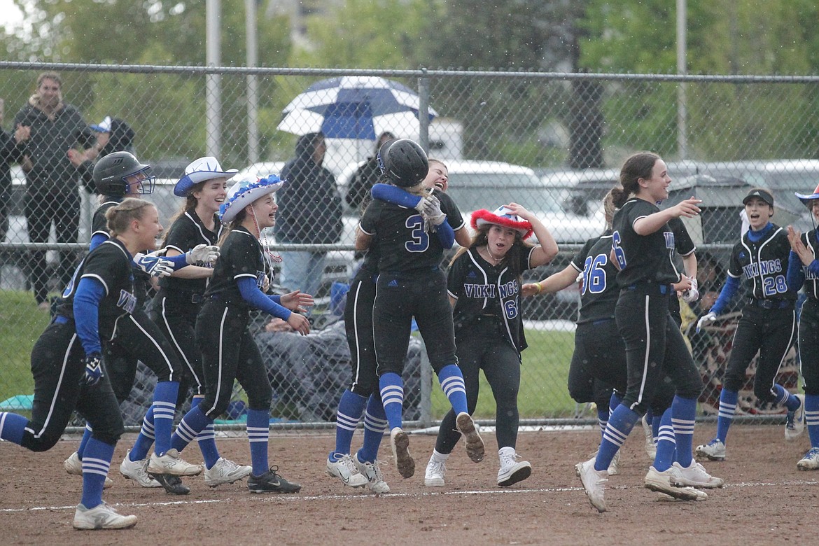 MARK NELKE/Press
Coeur d'Alene celebrates after beating Lake City 10-0 in the championship game of the 5A Region 1 softball tournament Tuesday at Coeur d'Alene High.