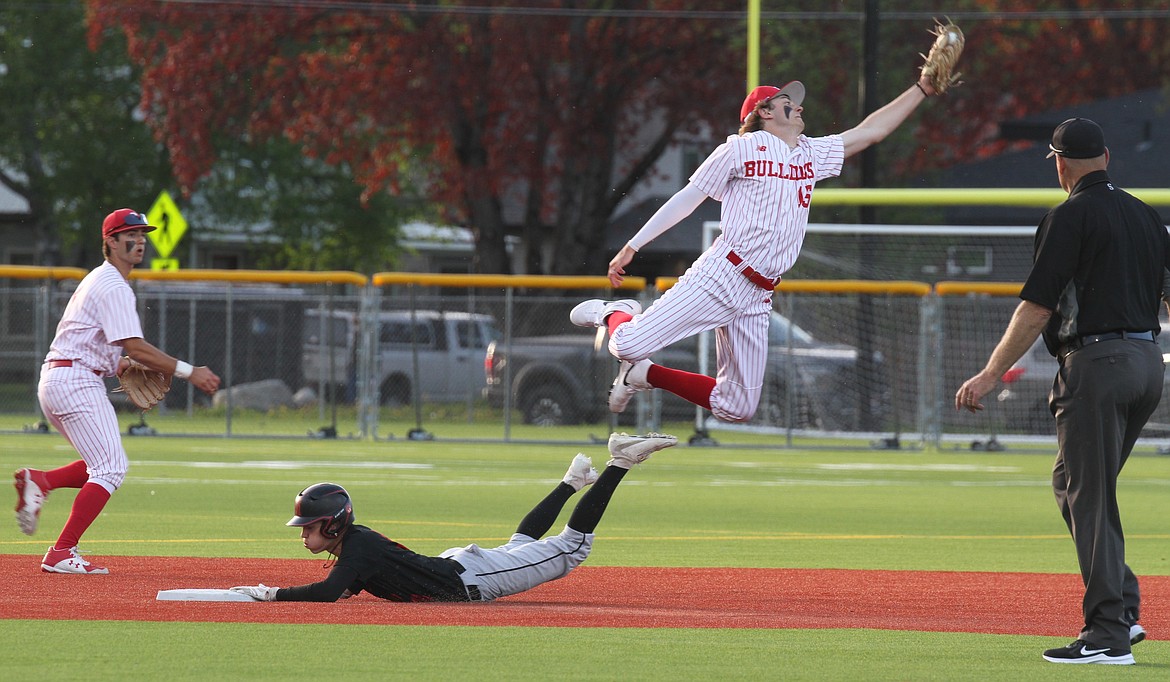 Kody MacDonald makes a leaping grab to save a ball from going into the outfield on a Moscow stolen base attempt.