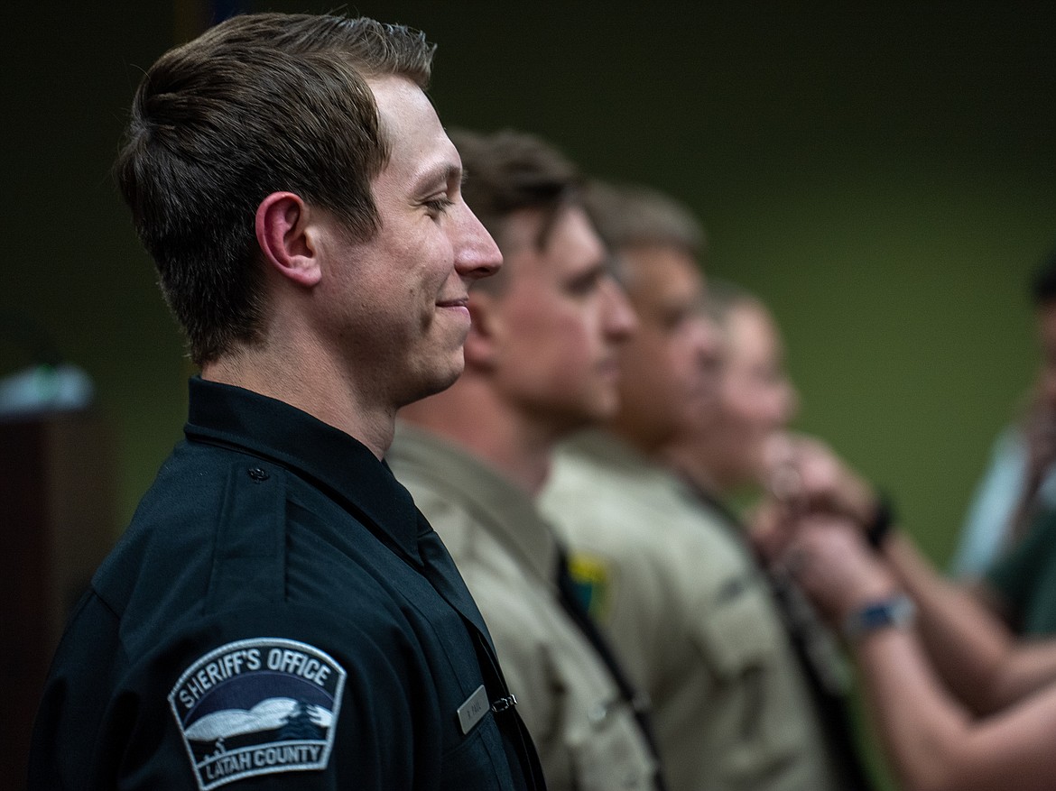 Rowdy Paul, left, and classmates, look on after graduating from North Idaho College’s Basic Patrol Academy on Thursday, May 4 at the Lake Coeur d’Alene Room in the Edminster Student Union Building on NIC’s Coeur d’Alene campus.