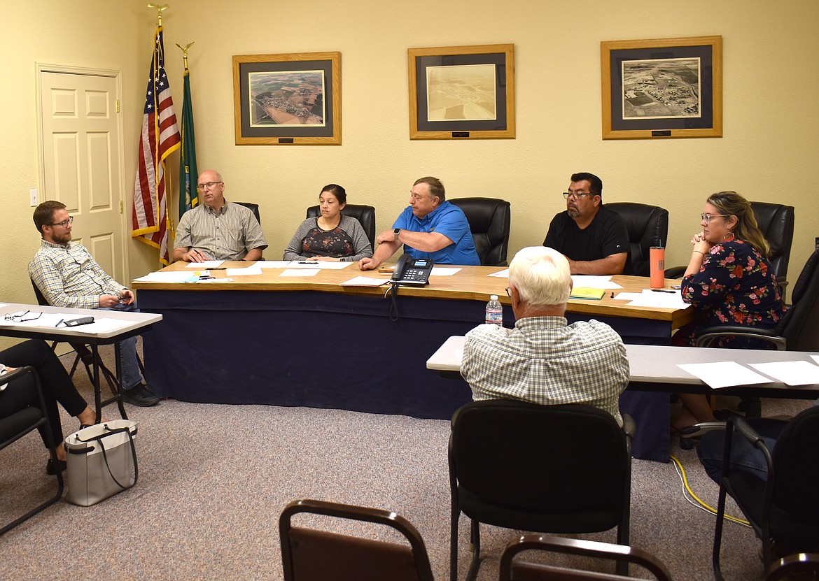 City Finance Director Shilo Christensen discusses insurance options with the Royal City City Council. From left: Shilo Christensen, Council Member Michael Christensen, Council Member Perla Garcia, Mayor Kent Anderson, Council Member Hector Rodriguez and Council Member Tiffany Workinger.