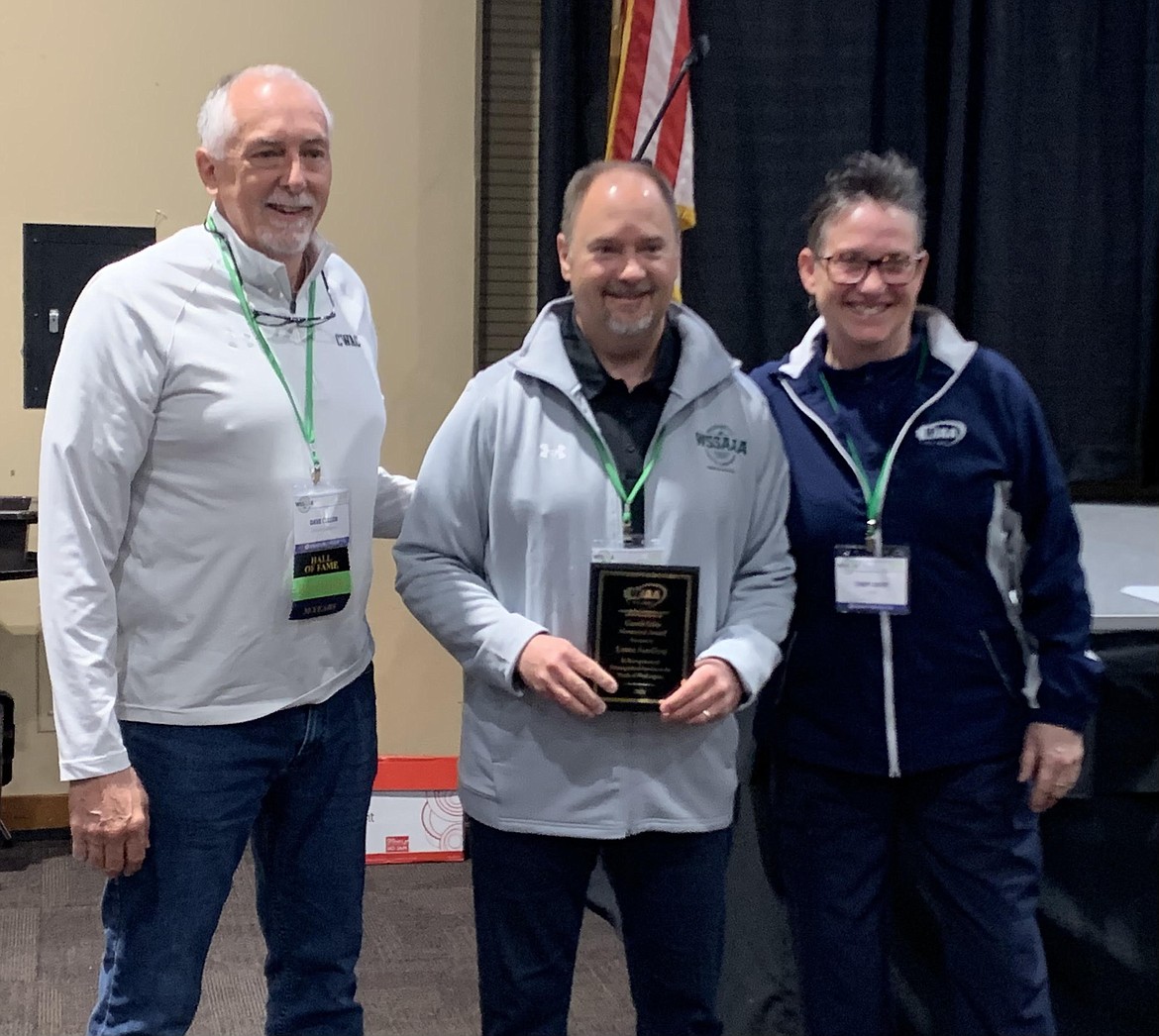 Moses Lake Athletic Director Loren Sandhop, middle, was named a recipient of the Gareth Giles Award at last month’s Washington State Secondary Athletic Administrators Association Conference.