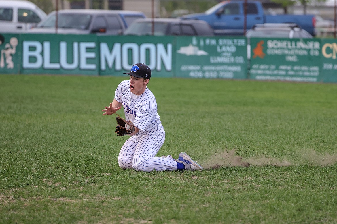 Mark Robison catches an out at home Thursday against Polson. (JP Edge photo)