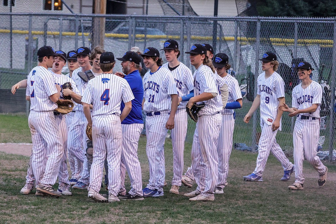 Kellen Kroger, at left, is congratulated by teammates after throwing a no-hitter against conference rival Polson last week. (JP Edge photo)