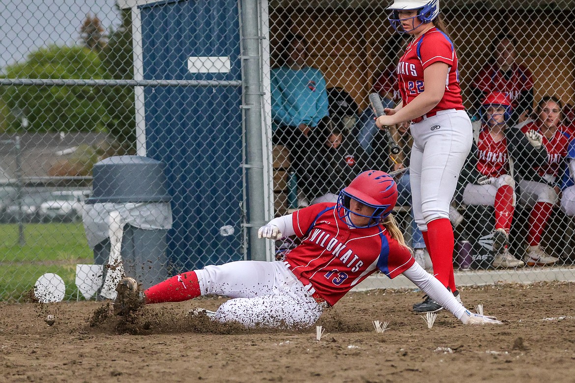 Senior Sydney Mann slides to score at home against Libby on Friday. (JP Edge photo)