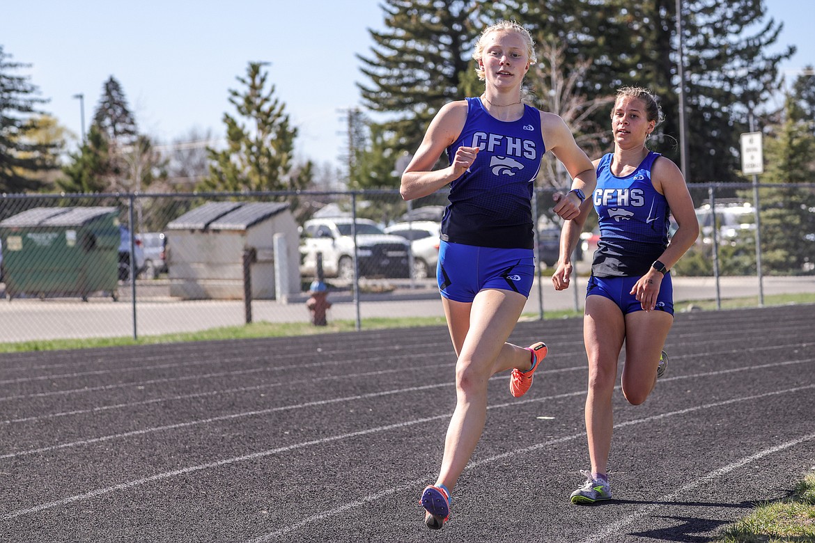 Siri Erickson and Mya Badger in the 800 at the Cat-Dog meet on Tuesday. (JP Edge photo)