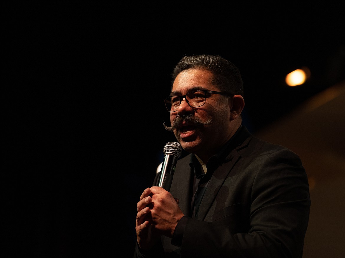 NIC Director of Choirs Max Mendez speaks onstage during NIC’s Spring Celebrations concert on May 2 at Boswell Hall Schuler Performing Arts Center on NIC’s Coeur d’Alene campus.