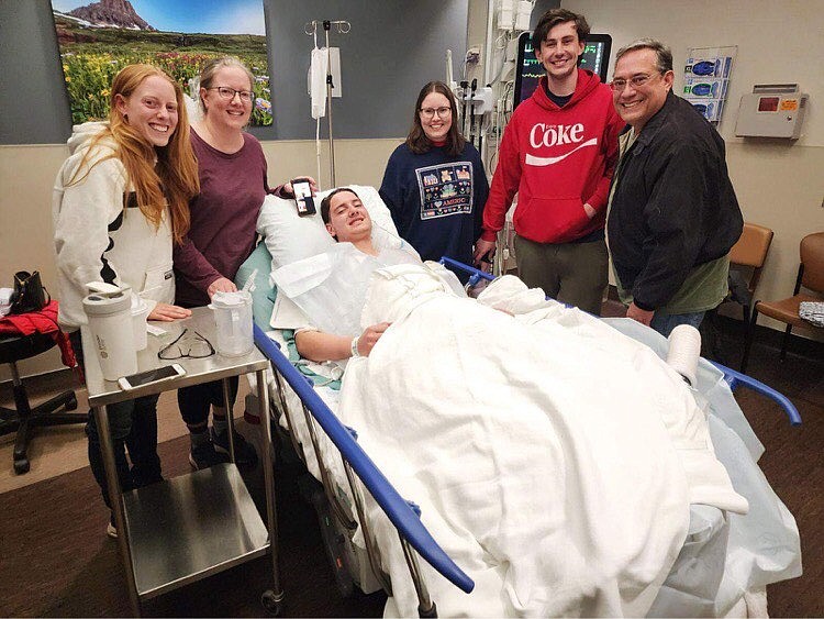 19-year-old Matthew Read at Logan Health in Kalispell, surrounded by family members. He was missing for several days in Glacier National Park after attempting to hike the Huckleberry Lookout trail on Friday. (photo provided)