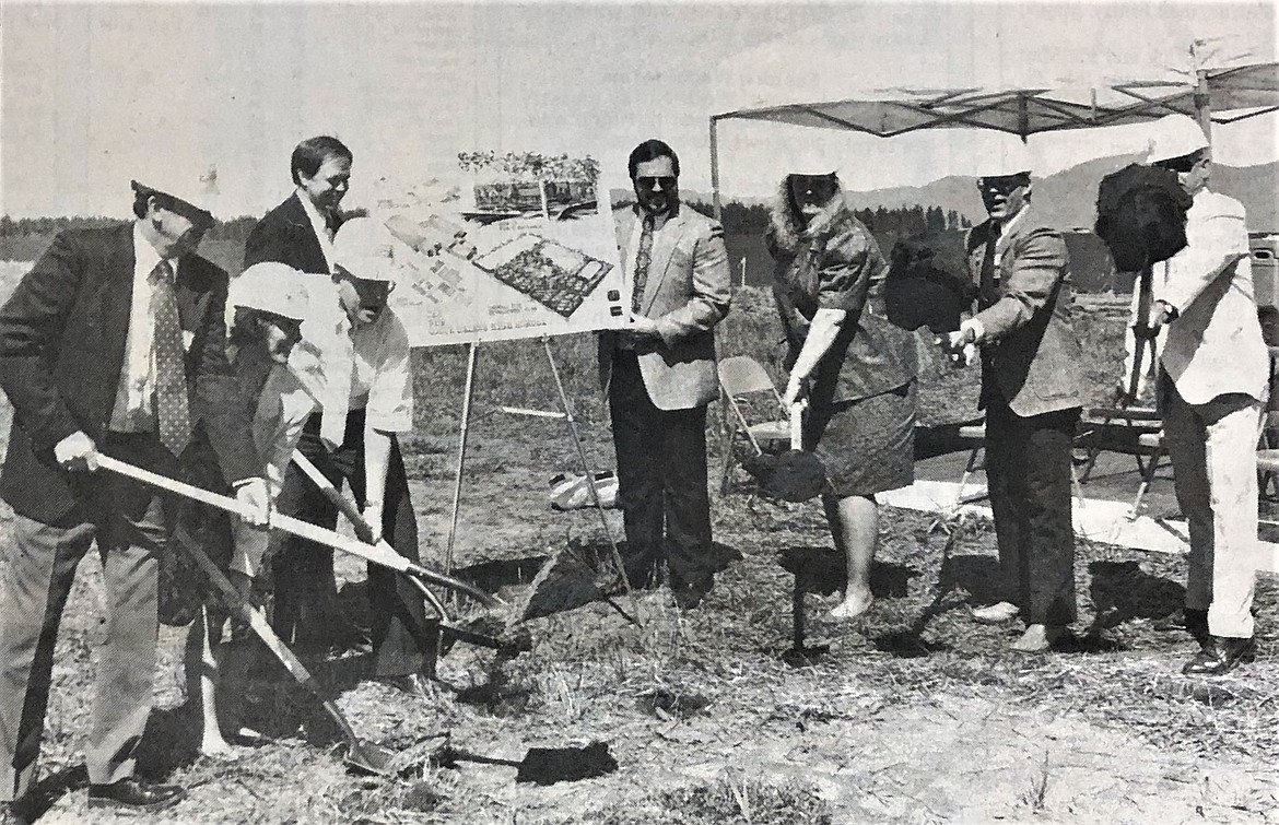 Superintendent Doug Cresswell, left, principal John Brumley, center, and the Coeur d'Alene School Board break ground on the new high school.