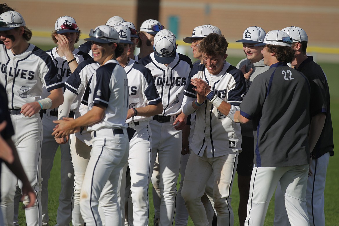 JASON ELLIOTT/Press
Members of the Lake City High baseball team celebrate after beating Lewiston 6-2 in the 5A Region 1 championship game on Wednesday, clinching a berth in the state tournament starting next Thursday in Caldwell.