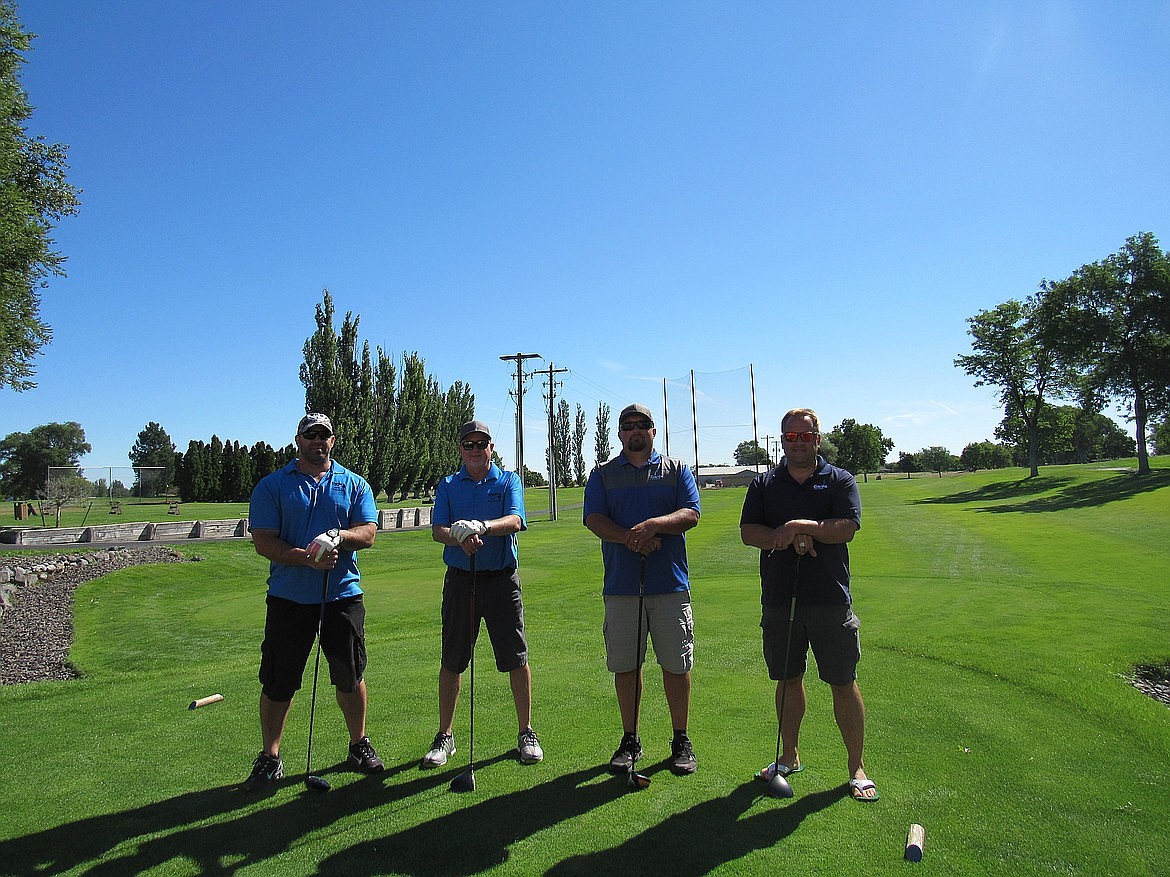 From left to right: Team Genie composed of Jake Visker, Todd Jewell, Bryan Jewell and Phillip Kassman compete at the 20th Annual Moses Lake Chamber of Commerce Golf Scramble in 2020.