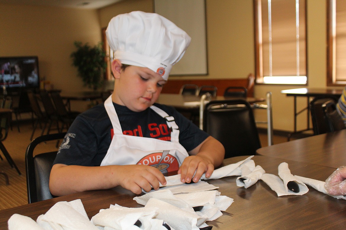 Trinette Mullineaux stirs the soup pot, preparing the main course for the Soup on Saturdays project.