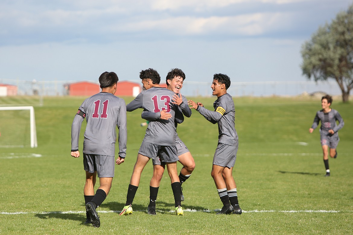 Wahluke players celebrate after a goal by sophomore Alex Acevedo (13). Acevedo scored the Warrior’s third goal of the first half in Tuesday’s 5-0 win over Wapato.