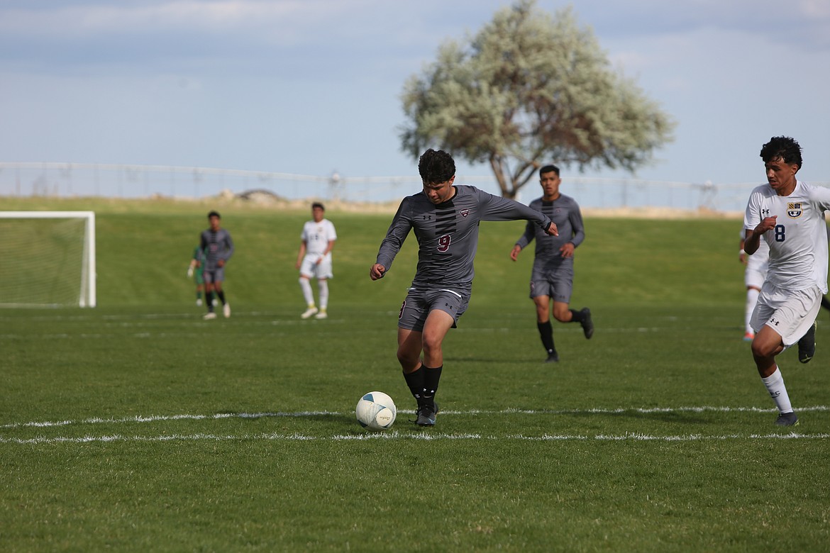 Wahluke junior Diego Olivares runs toward the Wapato net in the first half of Tuesday’s SCAC semifinal win.