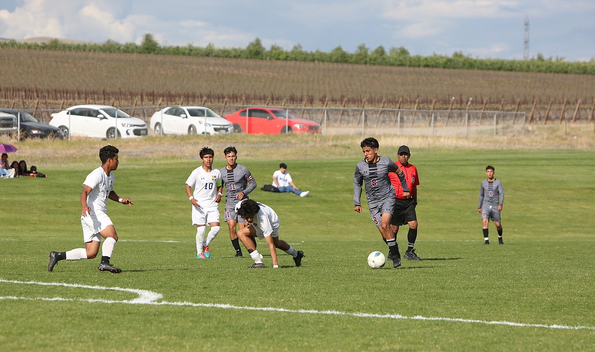 Wahluke junior Brian Herrera shakes off a Wapato defender in the first half.