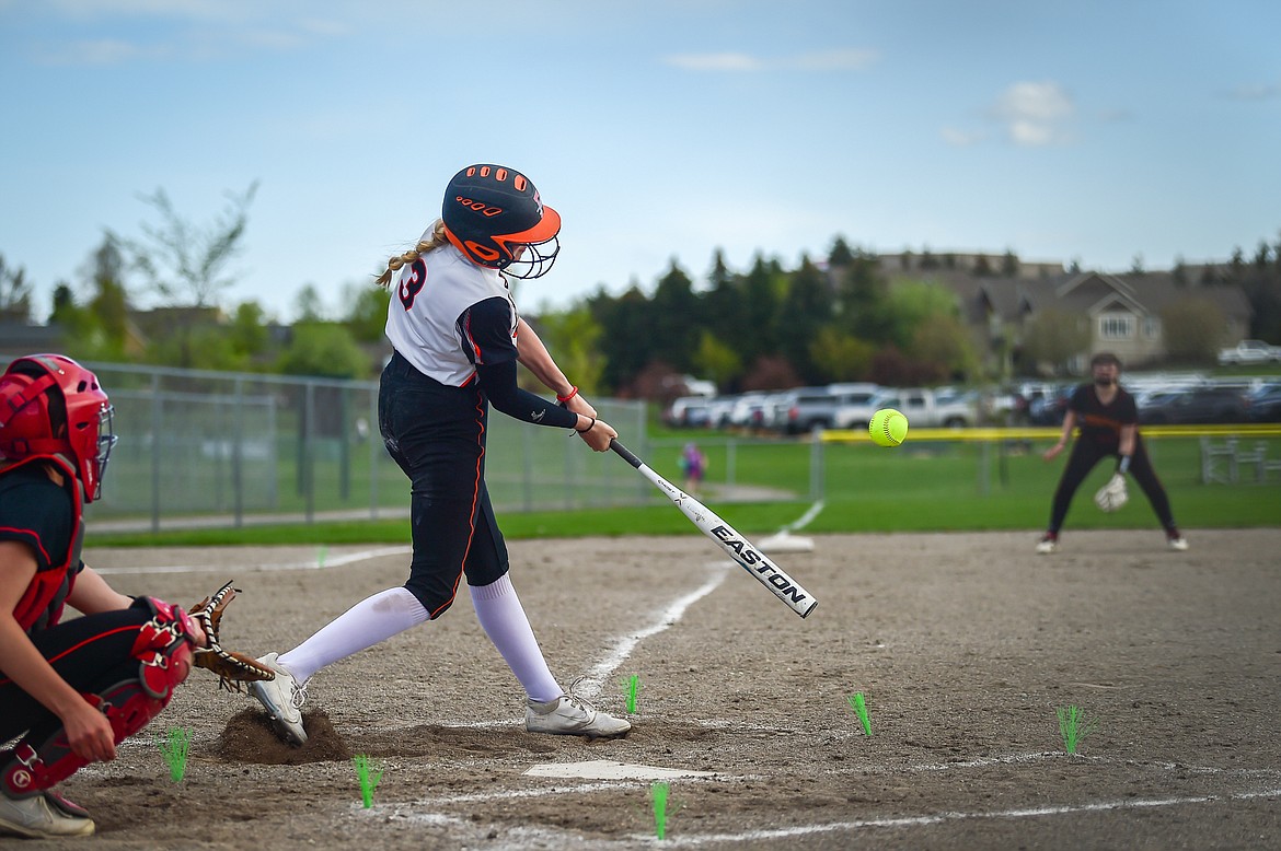 Flathead's Macey McIlhargey (3) connects on her second hit of the game in the third inning against Missoula Hellgate at Kidsports on Thursday, May 11. (Casey Kreider/Daily Inter Lake)