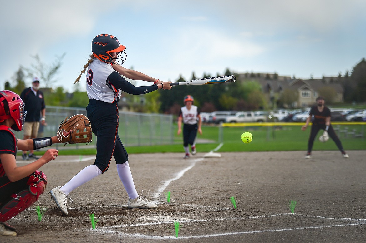 Flathead's Macey McIlhargey (3) drives in two runs in the first inning against Missoula Hellgate at Kidsports on Thursday, May 11. (Casey Kreider/Daily Inter Lake)