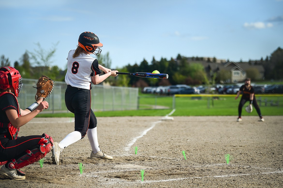 Flathead's Mackenzie Brandt (8) rips a triple down the line in the fourth inning against Missoula Hellgate at Kidsports on Thursday, May 11. (Casey Kreider/Daily Inter Lake)