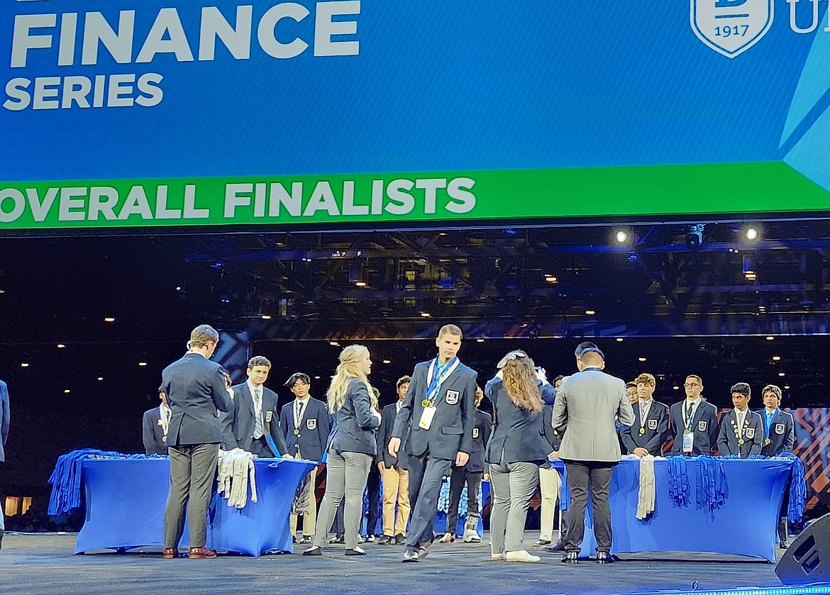 Post Falls High School senior Micah Green, center, facing camera, is seen on stage at the DECA International Career Development Conference in Orlando, where he earned the organization's highest honors. The conference was held April 21-25.