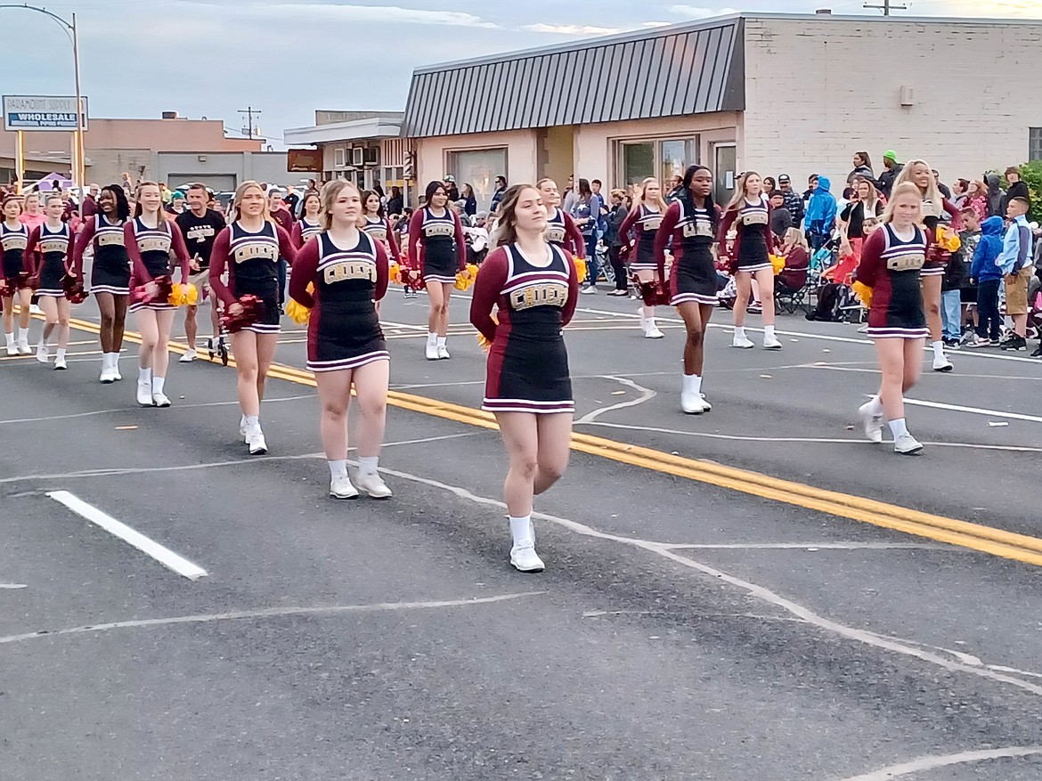 The Moses Lake High School cheerleaders – the last to wear the Chiefs uniform – march down Third Avenue in last year’s Spring Festival Grand Parade. This year’s festival is May 25-28.