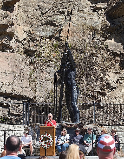 Don Capparelli, emotional at times, addresses the crowd during the memorial ceremony for the 51st anniversary of the Sunshine Mine Disaster. Capparelli was a miner at the Sunshine during the time of the fire, but had traded shifts and was not at the mine that day. He joined the rescue efforts in the days that followed.