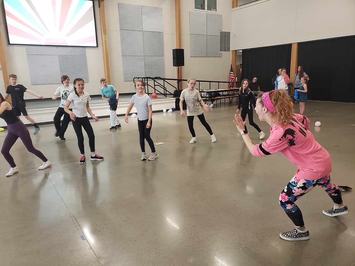 Hayden Canyon Charter's director of special education, Mica Clarkson leads an impromptu Zumba-style dance breakout during a dance-a-thon Friday. The dancers and students gather sponsors to raise money for mirrors.