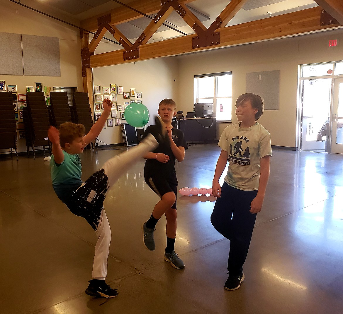 From left, Hayden Canyon Charter Hip Hop Dance Club members Austin Bartel, Preston Dunn and Aiden Bergreen participate in a dance-a-thon to raise money to buy mirrors for the school's Wednesday dance class.