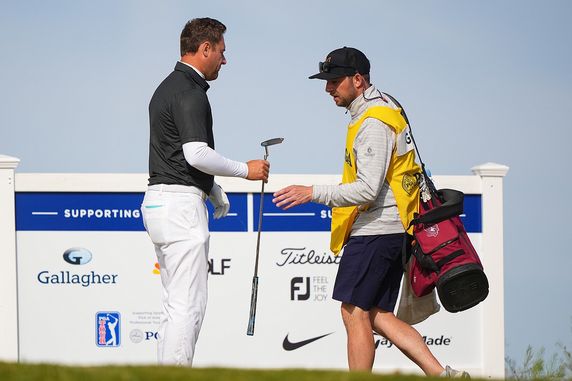 DARREN CARROLL/PGA of America
North Idaho College golf coach Russell Grove with his caddie, Coeur d'Alene High product Taylor Pierce, at the 10th hole during the final round of the 55th PGA Professional Championship at Twin Warriors Golf Club on May 3, 2023 in Santa Ana Pueblo, N.M.