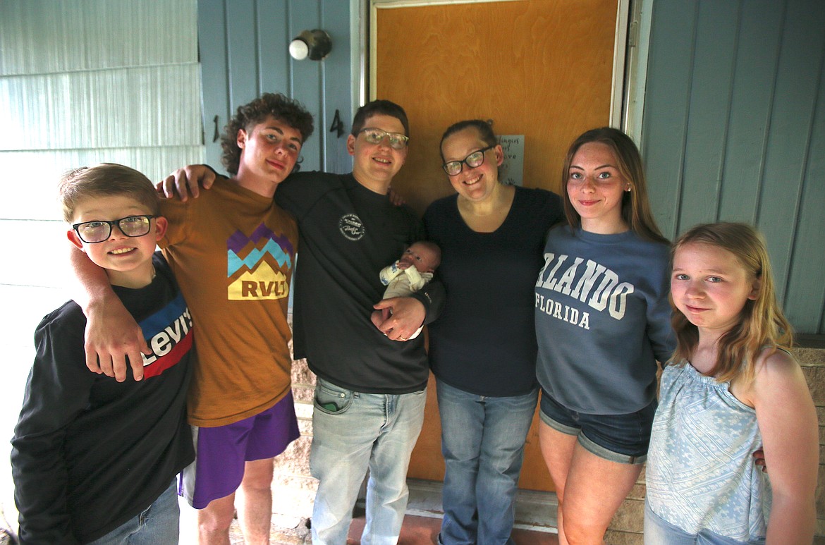 The Aurora family is a loving mix of fostering, adoption and natural birth. From left: Bryson, Jacob, dad Justin, baby Waylon, mom Ashlee, Justyce and Lily.