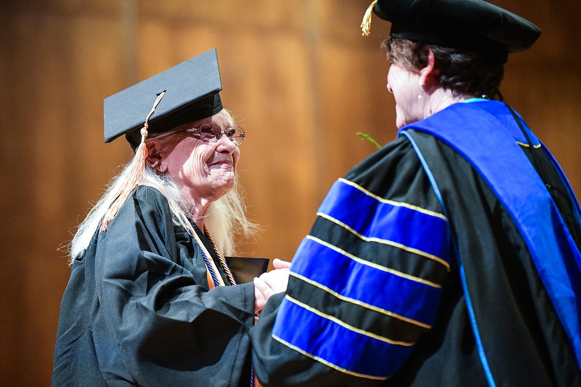 Flathead Valley Community College President Dr. Jane Karas shakes the hand of a graduate after receiving her degree at FVCC's Class of 2023 commencement ceremony inside McClaren Hall at the Wachholz College Center on Friday, May 12. A total of 268 graduates were honored receiving 288 degrees and certificates. (Casey Kreider/Daily Inter Lake)