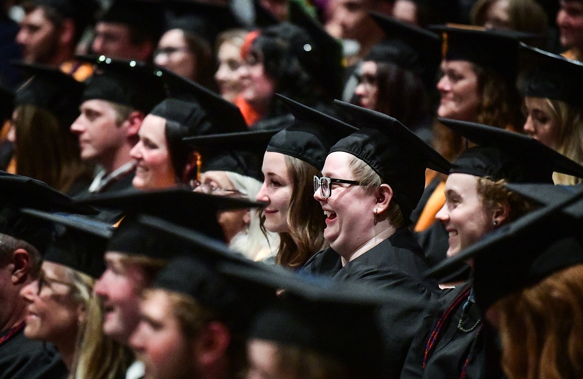 Graduates laugh during a speech by Dr. Christina Relyea, of the Science and Engineering Division, at Flathead Valley Community College's Class of 2023 commencement ceremony inside McClaren Hall at the Wachholz College Center on Friday, May 12. A total of 268 graduates were honored receiving 288 degrees and certificates. (Casey Kreider/Daily Inter Lake)