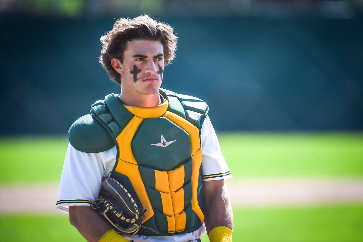 Whitefish catcher Fynn Ridgeway (7) looks on in between innings against the Hamilton Broncs in the Sapa-Johnsrud Baseball Invitational at Memorial Field in Whitefish on Saturday, May 13. (Casey Kreider/Daily Inter Lake)