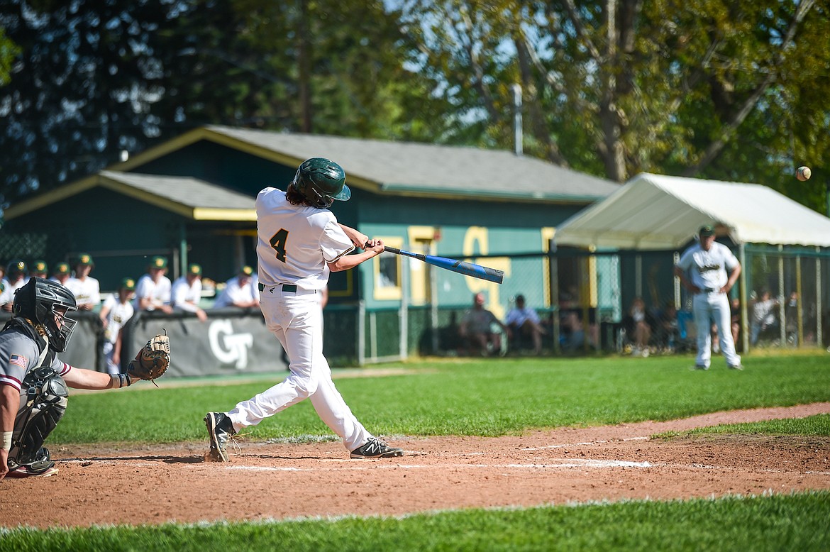 Whitefish's Maddox Muller (4) connects on a single against the Hamilton Broncs in the Sapa-Johnsrud Baseball Invitational at Memorial Field in Whitefish on Saturday, May 13. (Casey Kreider/Daily Inter Lake)