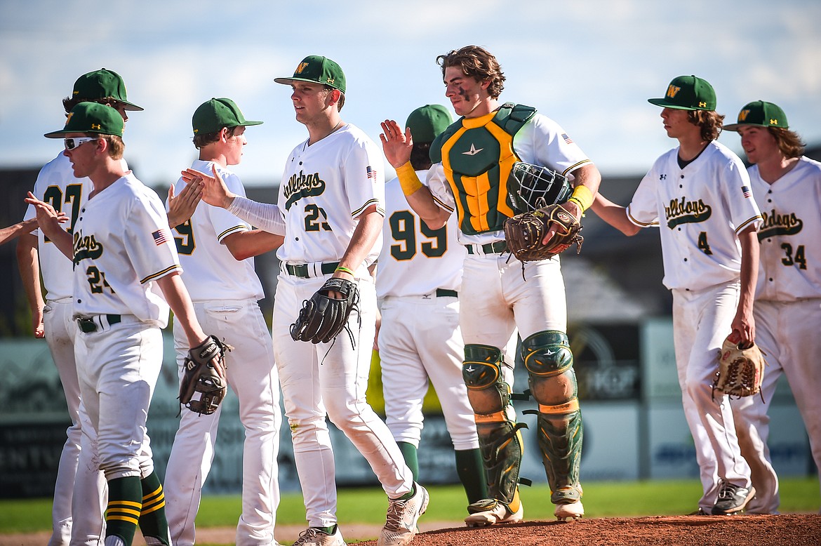 The Whitefish Bulldogs celebrate after an 8-2 win over the Hamilton Broncs in the Sapa-Johnsrud Baseball Invitational at Memorial Field in Whitefish on Saturday, May 13. (Casey Kreider/Daily Inter Lake)