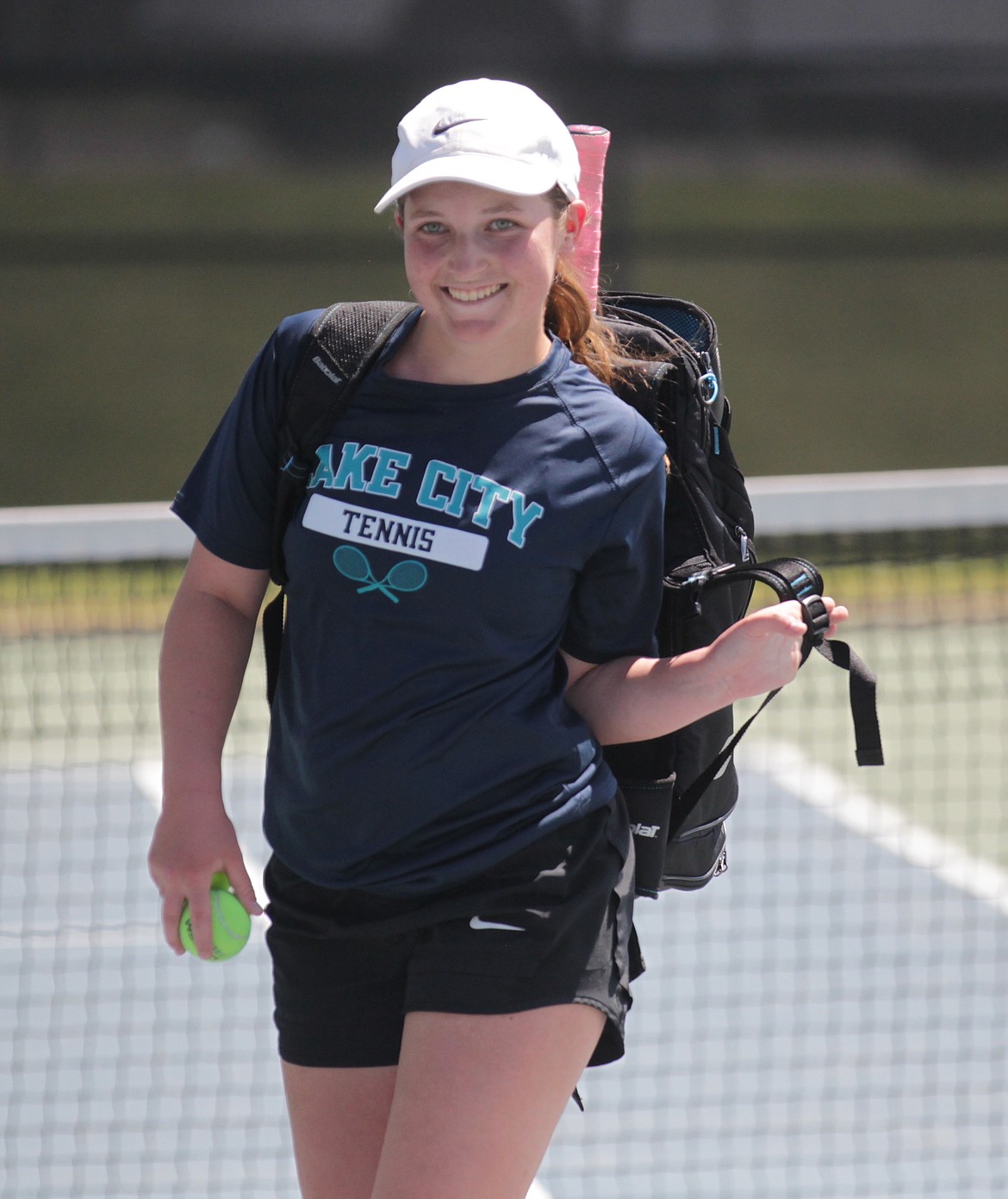 MARK NELKE/Press
Lake City High junior Maddy Nesbit smiles at teammates and friends after winning the girls singles title Saturday at the 5A Region 1 tennis tournament at Coeur d'Alene High.