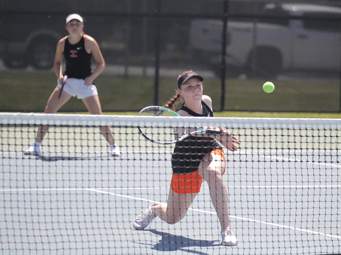 MARK NELKE/Press
Addie Muir of Post Falls volleys as teammate Madi Barkley watches during the girls doubles finals at the 5A Region 1 tennis tournament Saturday at Coeur d'Alene High. Muir and Barkley defeated a team from Lewiston in the finals.