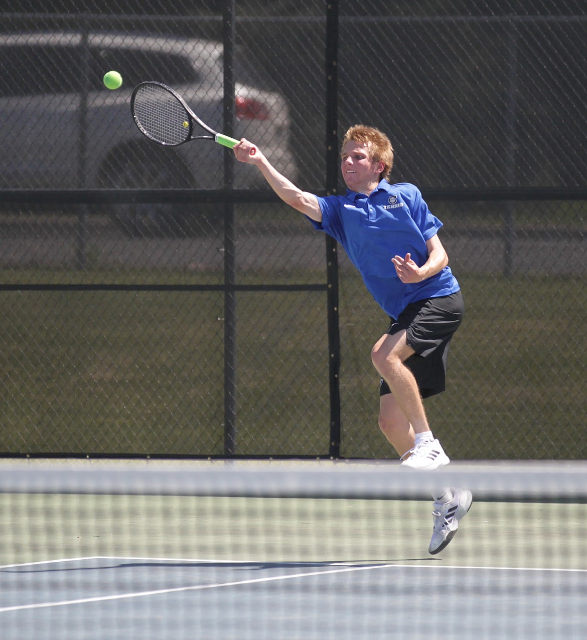 MARK NELKE/Press
Turner Cox of Coeur d'Alene hits a return during the boys singles final at the 5A Region 1 tennis tournament Saturday at Coeur d'Alene High. Cox lost to Dylan Gomez of Lewiston in the finals; both qualified for state.