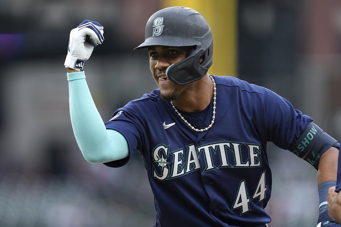Seattle Mariners' Julio Rodriguez celebrates his RBI single against the Detroit Tigers in the second inning of a baseball game, Friday, May 12, 2023, in Detroit.