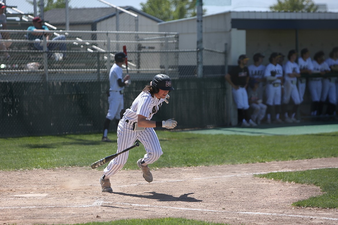 Moses Lake senior Braeden Anderson begins to run toward first base after making contact with a pitch.